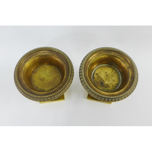 118 - Pair of ormolu campana vases with beaded rims and frieze of classical figures, on socle bases, 13.5c... 