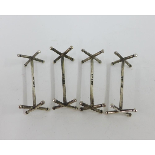 62 - A quantity of silver napkin rings, silver sugar tongs and silver knife rests, various hallmarks (a l... 