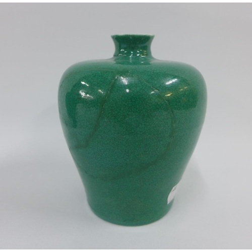 82 - A pair of Chinese apple green glazed meiping vases with a craquelure ground, each with six character... 