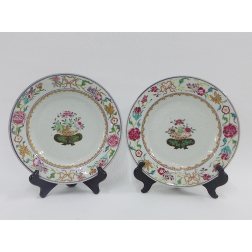 86 - A pair of Chinese 18th century porcelain plates with floral borders and basket of flowers pattern, t... 