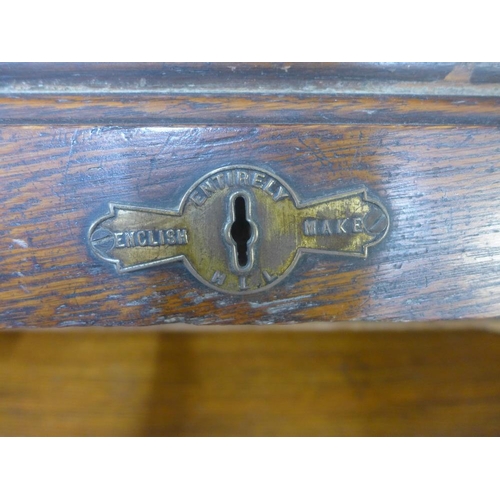 238 - Early 20th century oak roll top desk of traditional design, 140 x 119 x 76cm