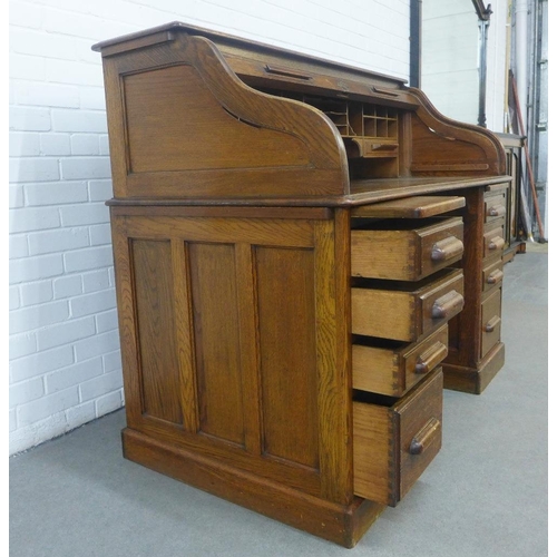 238 - Early 20th century oak roll top desk of traditional design, 140 x 119 x 76cm