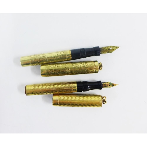 45 - 9ct gold propelling pencil, London 1973, together with a small fountain pen stamped 14k and two  gol... 