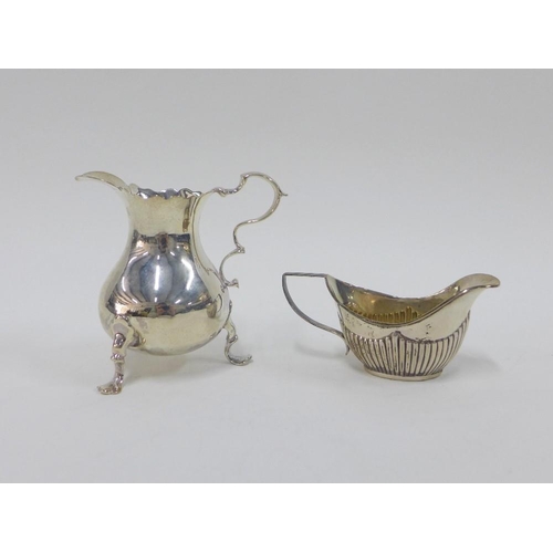 43 - Georgian silver cream jug, rubbed, London hallmarks, 9cm, and a Georgian style silver gilt miniature... 
