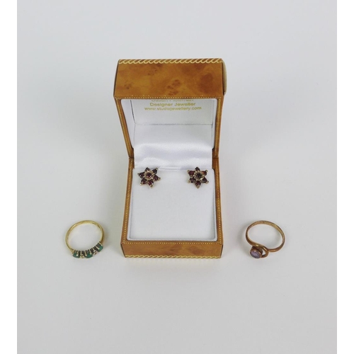 33 - Two 9ct gold gemset rings and a pair of 9ct gold flowerhead earrings (3)