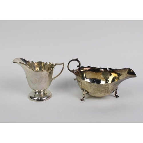 46 - Edwardian silver cream jug, Chester 1908 and a George VI silver sauce boat, Birmingham 1939, largest... 