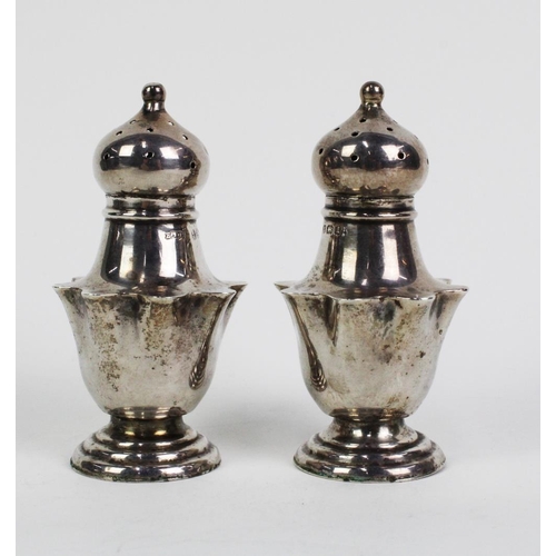 56 - A pair of Edwardian silver pepper pots, Birmingham 1910, (2)
