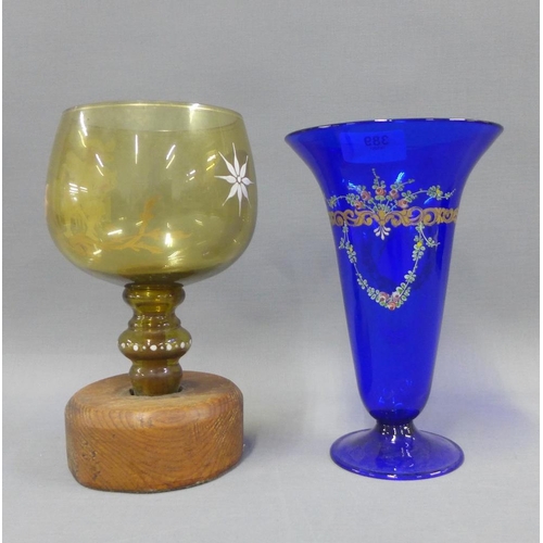 389 - Coloured and enamelled glass to include a blue vase with a flared rim and amber glass goblet with a ... 