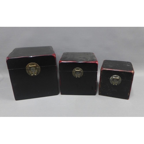 406 - A set of three red and black lacquered chinoiserie boxes, largest 25 x 25cm (3)