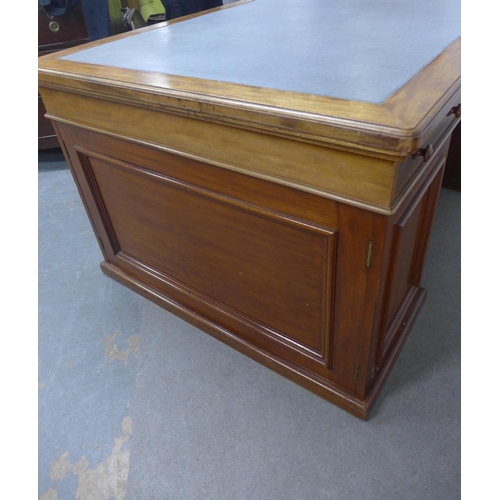 413 - Mahogany partner's desk, the rectangular top with a pale blue leather skivver, with a drawer to each... 