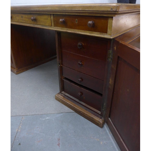 413 - Mahogany partner's desk, the rectangular top with a pale blue leather skivver, with a drawer to each... 