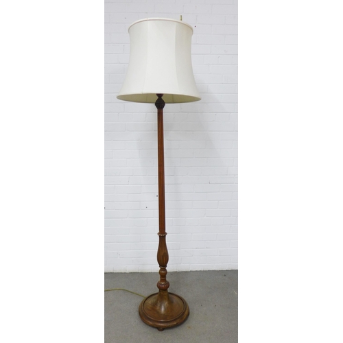 424 - Mahogany standard lamp of fluted design, on a circular base , 188cm high  including shade