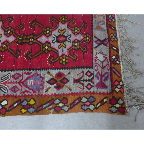 429 - Kelim rug, red field and geometric pattern, 210 x 111cm