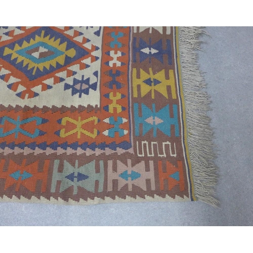 431 - Kelim rug, ivory field and multicoloured geometric pattern, 170 x 117cm