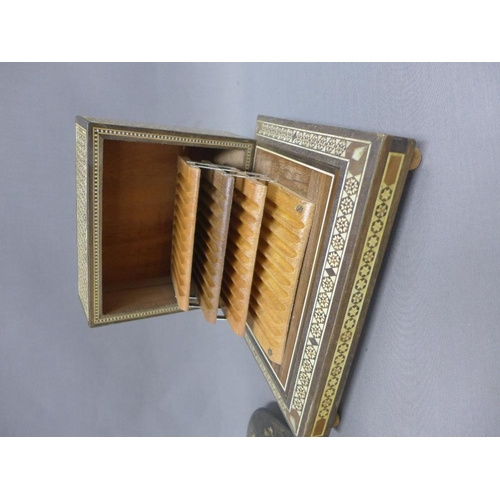 437 - Eastern inlaid musical cigarette box and a rectangular lacquered tray, largest 34cm long (2)