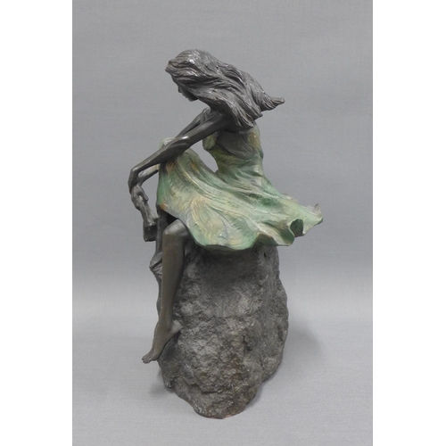 122 - Bronze patinated resin figure of a seated female, 29cm high