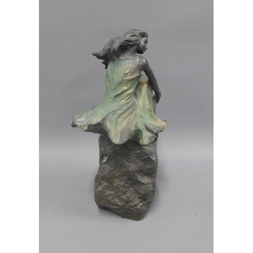 122 - Bronze patinated resin figure of a seated female, 29cm high