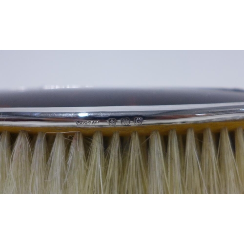 47 - Four piece silver mounted dressing table brush set, Birmingham 1927, in fitted case