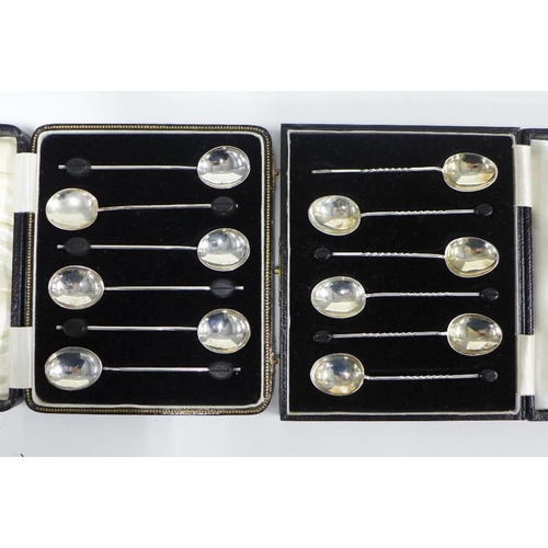 73 - Cased sets of silver spoons to include two sets of six coffee bean handled spoons and a set of six g... 