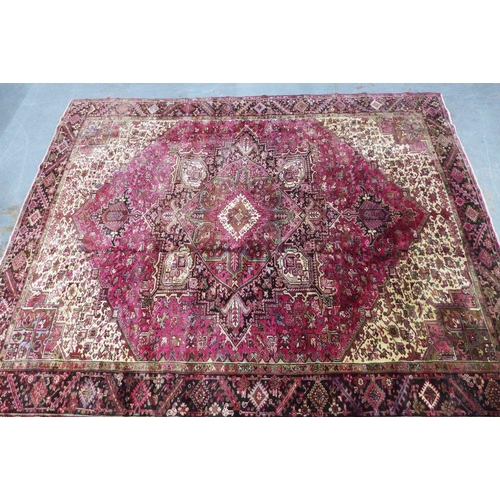 201 - North West Persian Heriz carpet, red field with central medallion, angular foliage and flowerhead bo... 