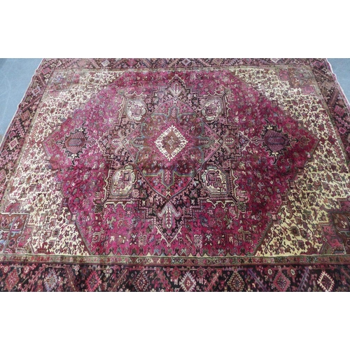 201 - North West Persian Heriz carpet, red field with central medallion, angular foliage and flowerhead bo... 