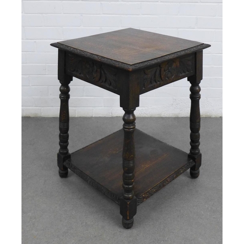 219 - Carved oak table, square top and floral carved frieze, with conforming undertier and turned legs, 48... 