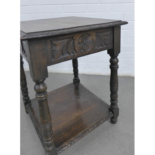 219 - Carved oak table, square top and floral carved frieze, with conforming undertier and turned legs, 48... 