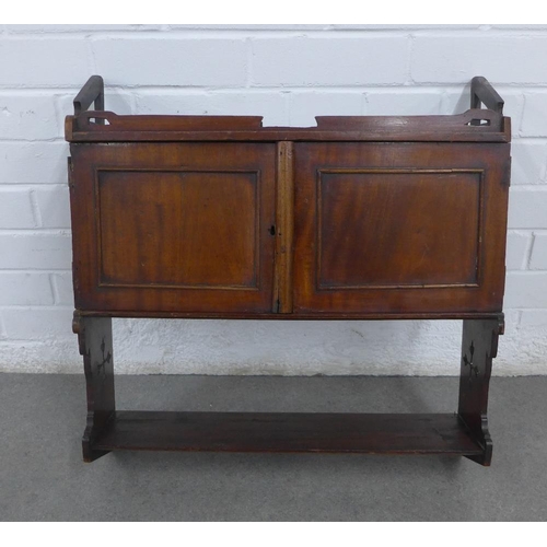 260 - Mahogany wall cabinet with a pair of cupboard doors above a single shelf, with Gothic pierced motifs... 