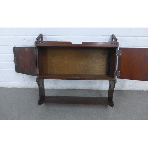 260 - Mahogany wall cabinet with a pair of cupboard doors above a single shelf, with Gothic pierced motifs... 