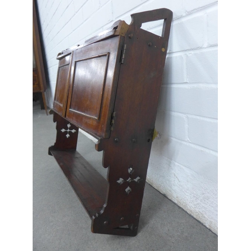 260 - Mahogany wall cabinet with a pair of cupboard doors above a single shelf, with Gothic pierced motifs... 