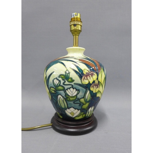 359 - Moorcroft table lamp base on a wooden base, height including fitting 29cm