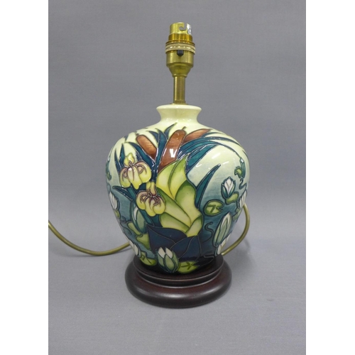 359 - Moorcroft table lamp base on a wooden base, height including fitting 29cm