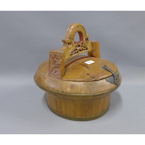 381 - Vietnamese wooden tub, with a detachable cover and stylised pierced handle, height 32cm