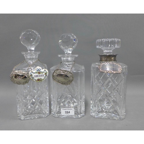 394 - Silver mounted cut glass spirit decanter and cover, two other glass decanters and stoppers, collecti... 