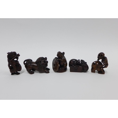 402 - A collection of five wooden netsukes to include a lion, dragon, skeleton, and rats, longest 6cm (5)