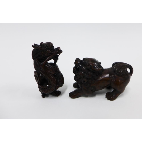 402 - A collection of five wooden netsukes to include a lion, dragon, skeleton, and rats, longest 6cm (5)