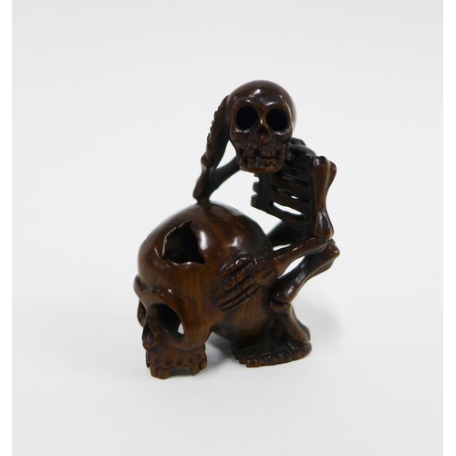 402 - A collection of five wooden netsukes to include a lion, dragon, skeleton, and rats, longest 6cm (5)