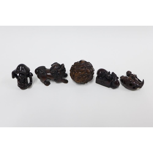 403 - A collection of five wooden netsukes to include a lion, rats, children and a ball, longest 6cm (5)