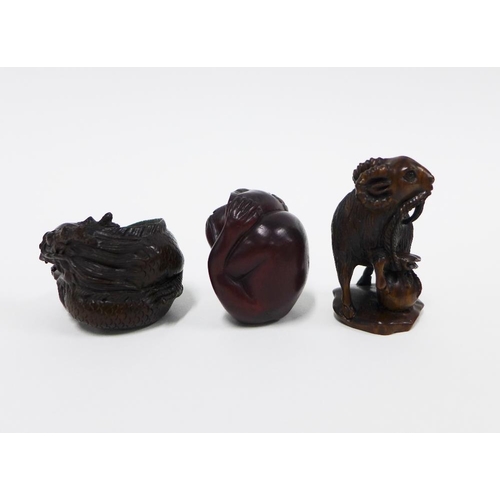 405 - A collection of three wooden netsukes to include a monkey, dragon and ram, tallest 5cm (3)