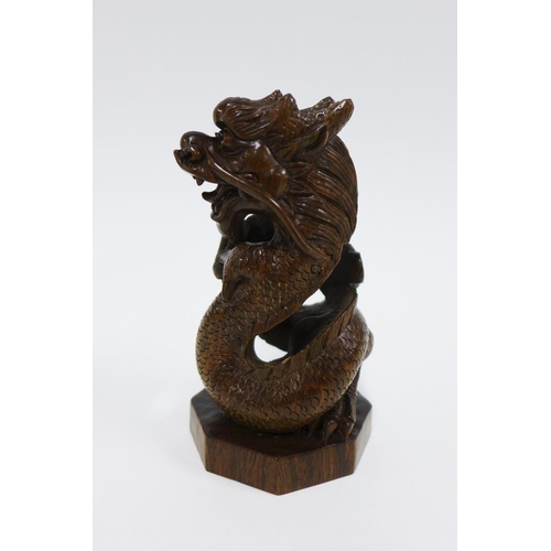 406 - Japanese wooden dragon on an octagonal base, signed, 9cm high