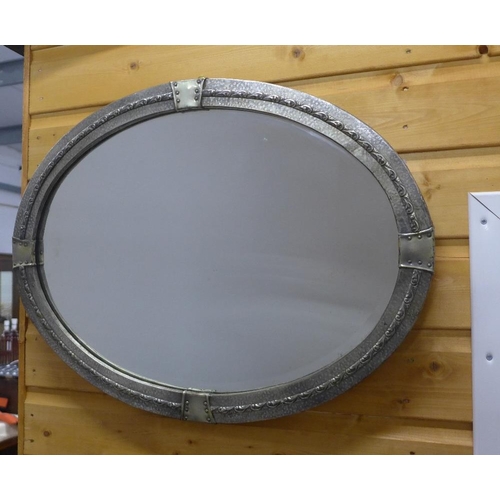 421 - Arts & Crafts style pewter framed wall mirror with an oval glass plate, 62 x 48cm