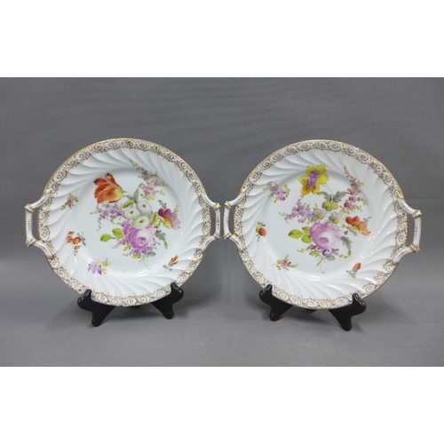 123 - Collection of Dresden floral patterned table wares to include two cake plates, muffin dish and cover... 