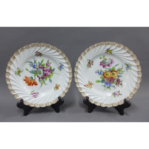 123 - Collection of Dresden floral patterned table wares to include two cake plates, muffin dish and cover... 