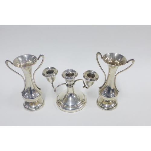 42 - A pair of George V silver vases, Birmingham 1912 together with a silver candelabra, Birmingham, 1967... 