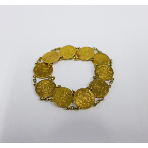 73 - Japanese gold Yen coin bracelet, with ten coins on a chain, clasp fitting.