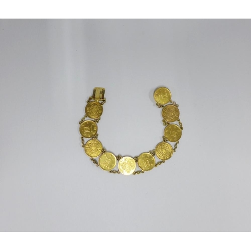 73 - Japanese gold Yen coin bracelet, with ten coins on a chain, clasp fitting.