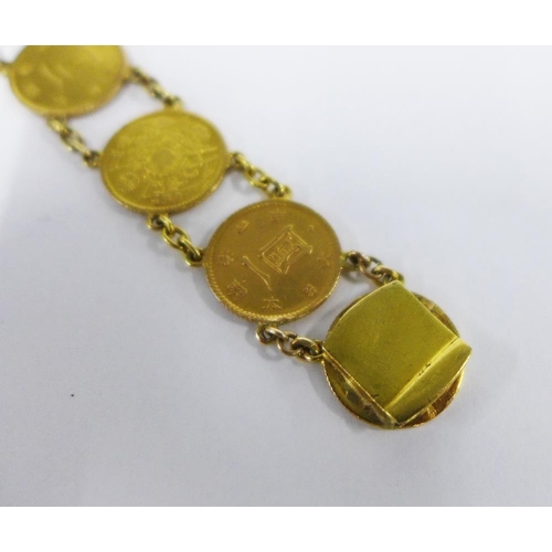 73 - Japanese gold Yen coin bracelet, with ten coins on a chain, clasp fitting.