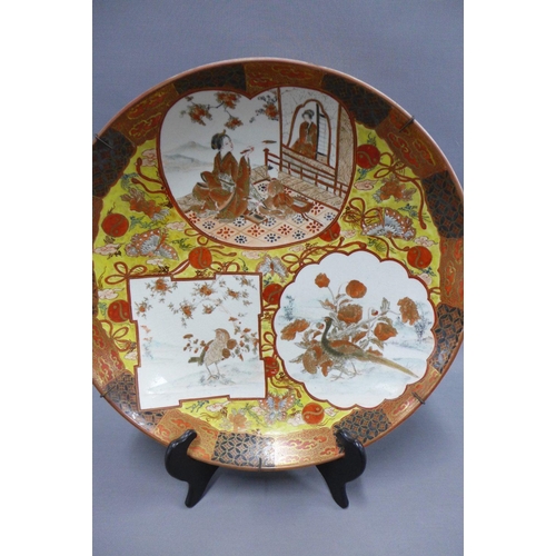 79 - Late 19th / early 20th century Japanese earthenware charger, painted with figures and other motifs a... 