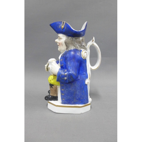 83 - 19th century Toby Jug, typically modelled seated with a jug of ale, wearing blue frock coat and tric... 