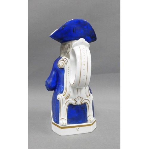 83 - 19th century Toby Jug, typically modelled seated with a jug of ale, wearing blue frock coat and tric... 